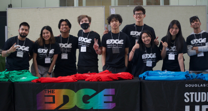 Student volunteers at the EDGE event booth